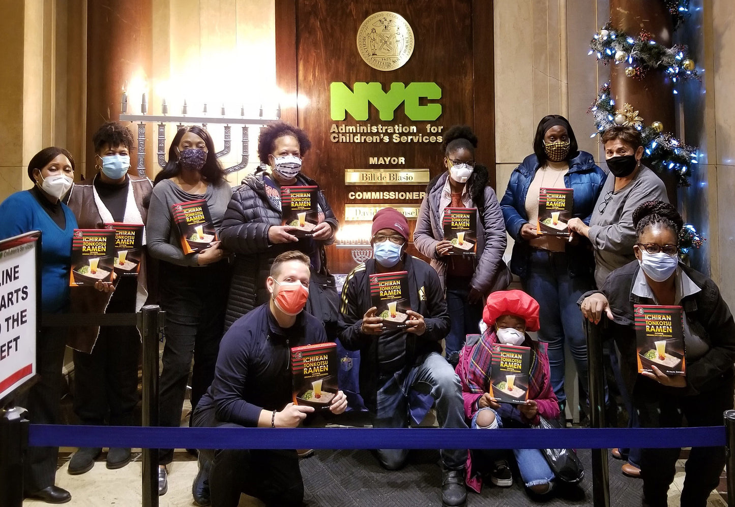 Staff, volunteers, and members of New Yorkers for Children holding ICHIRAN ramen kits